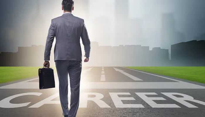 Business professional walking toward a road labeled'Career,' symbolizing the journey and challenges involved in making a career change.