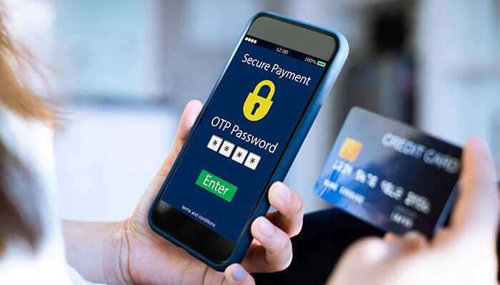 A person entering an otp password on a smartphone screen for a secure payment, with a credit card visible in the background, illustrating the security features of digital transactions like upi for fastag recharge.