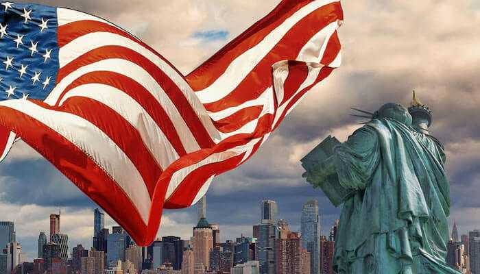 The statue of liberty and the american flag symbolizing opportunity and global success ideal for kashif alis journey to the usa