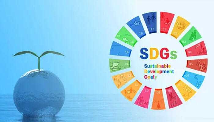 A representation of esg in sustainable development goals, featuring a plant sprouting from a globe and the sdg color wheel.