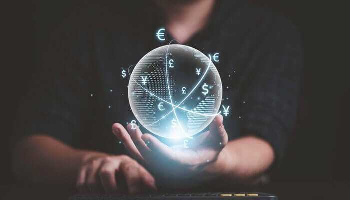 A person holding a glowing sphere with interconnected currency symbols, symbolizing quantum finance and a futuristic global financial network