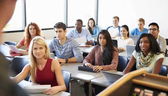 Students in a classroom setting, intently listening, representing interactive learning in gmat classes, mumbai.