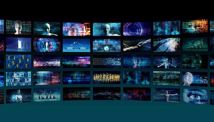 Digital media wall displaying futuristic visuals and data analytics concepts, representing advanced media measurement technology and cross-platform audience tracking