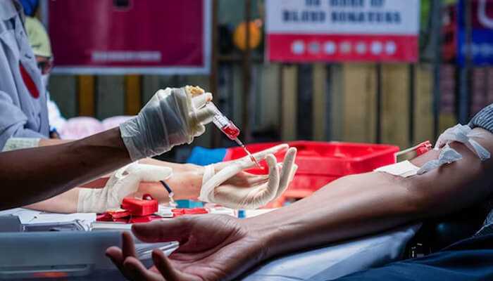 Bloodborne pathogens training - healthcare worker drawing blood for testing in a safe and controlled environment.