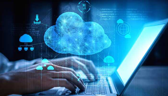 Person typing on laptop with digital cloud icons, illustrating secure and accessible sage 50 cloud hosting for financial management