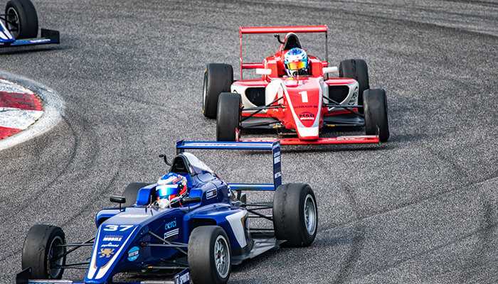 F1 driver stories in action as cars compete on track, highlighting intense rivalries and race-day drama.
