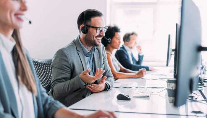 Team of agents delivering support services through outsourcing call centers, enhancing customer satisfaction and business scalability.