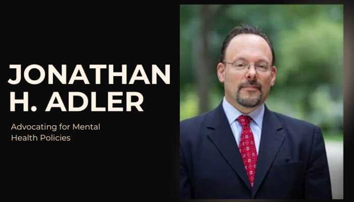 Jonathan h. Adler, advocate for mental health policies, in a professional suit and tie portrait.