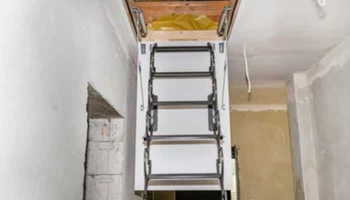Compact foldable attic ladder integrated seamlessly into the ceiling—showing how safety and style don’t have to fight in smart interior design.
