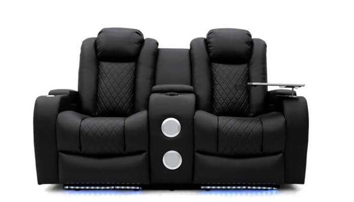 Luxurious black recliner with quilted seats and led lighting, compared to the modern ergonomic design of the honeypot tech eight smart chair.
